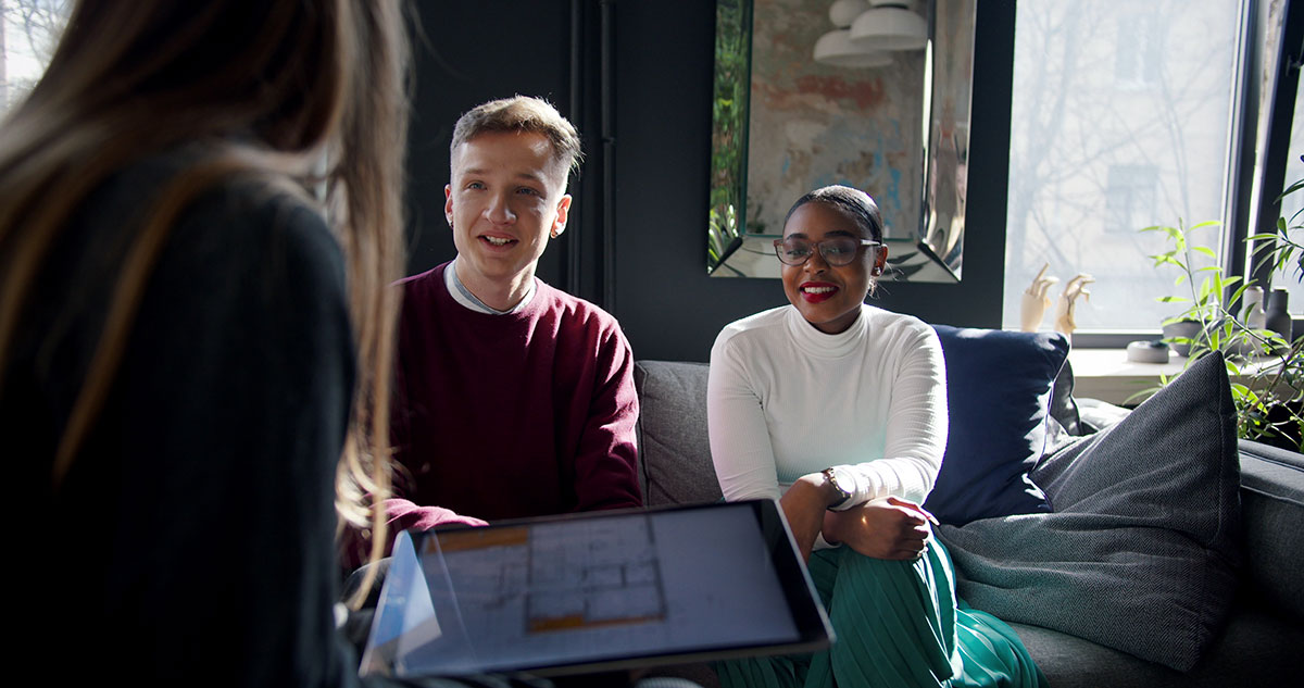 Generation Z workers collaborating on tablet