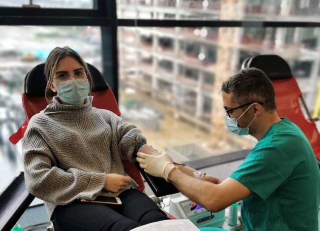 A team member of CGS Romania gives blood Blood drive blog image