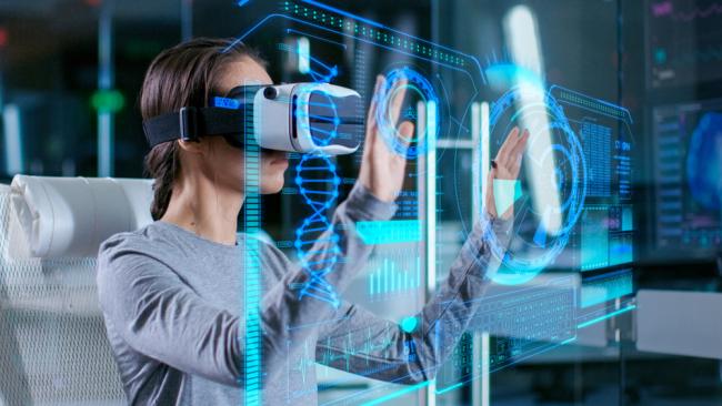 Scientist with Virtual Reality Headset interacts with holographic interface