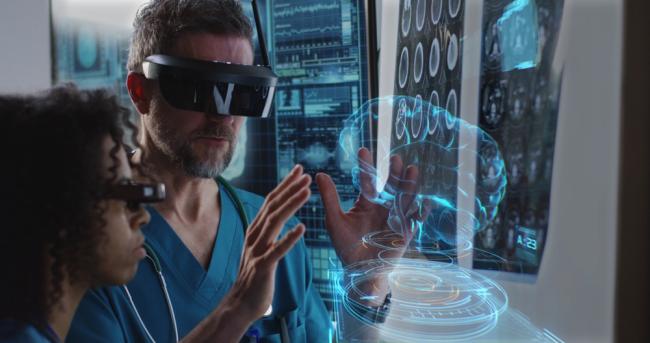 medical professionals using VR headset to examine human brain
