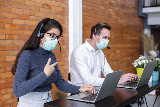 Call center representatives working in masks
