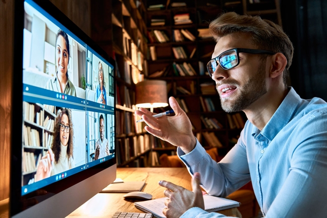 Employee on video call with coworkers