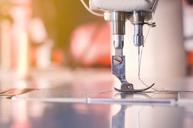 Close-up of sewing machine needle