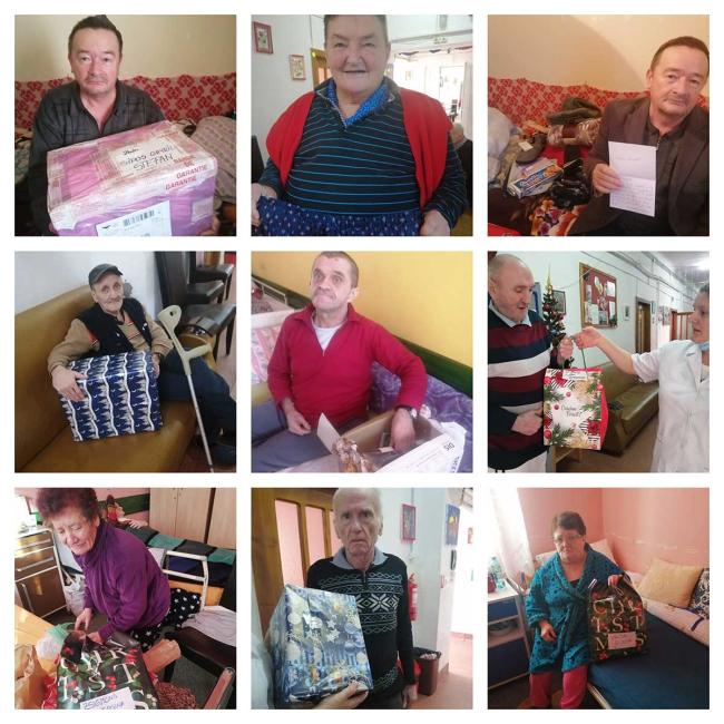 Residents open gifts from CGS Romania staff