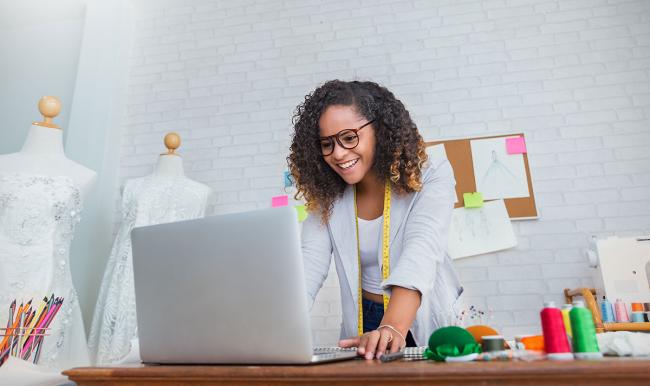 A fashion designer working on computer PLM