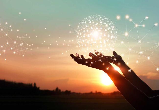 Channel enablement and marketing partners Hands with globe of light showing connection