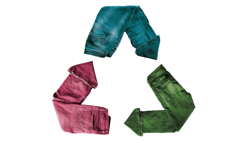 Colorful blue jeans forming a recycle symbol