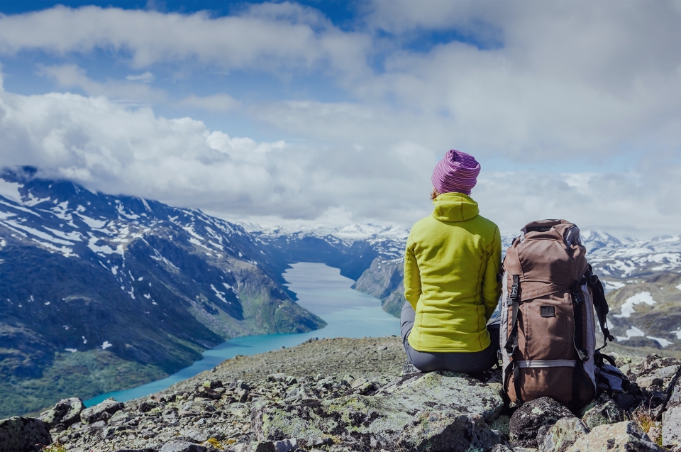 Woman sitting at a hike overlook