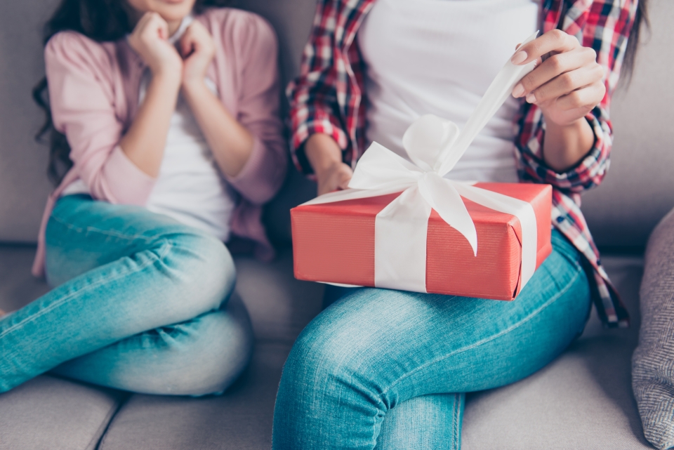 Woman opening a gift